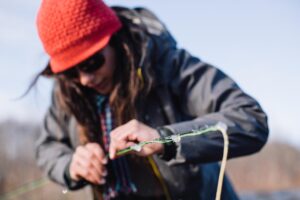 April Vokey Fishing Picking Ice out of her guides - Jeremy Koreski photo